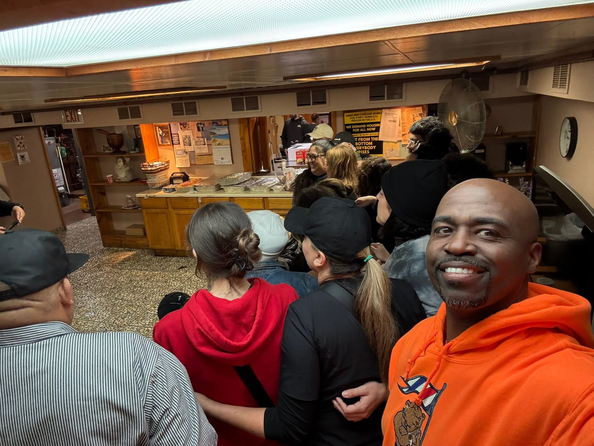Anthony Spaulding volunteering at a community event with a group of volunteers