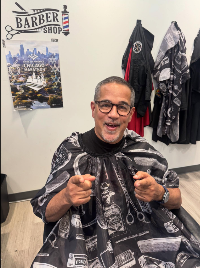 Happy client in the barber chair at the shop